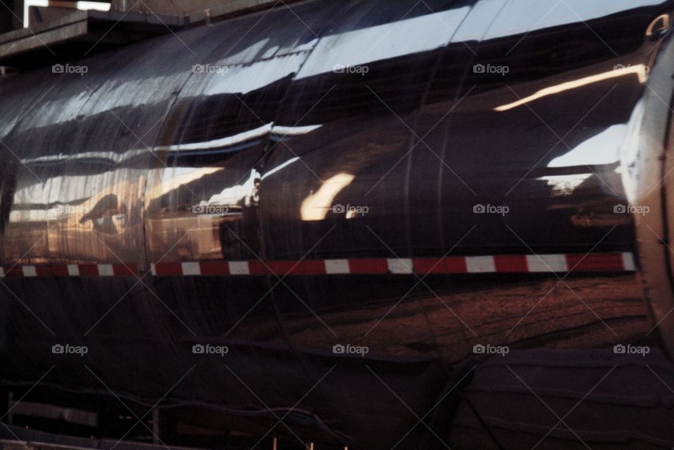 A tanker truck passes by at close range.