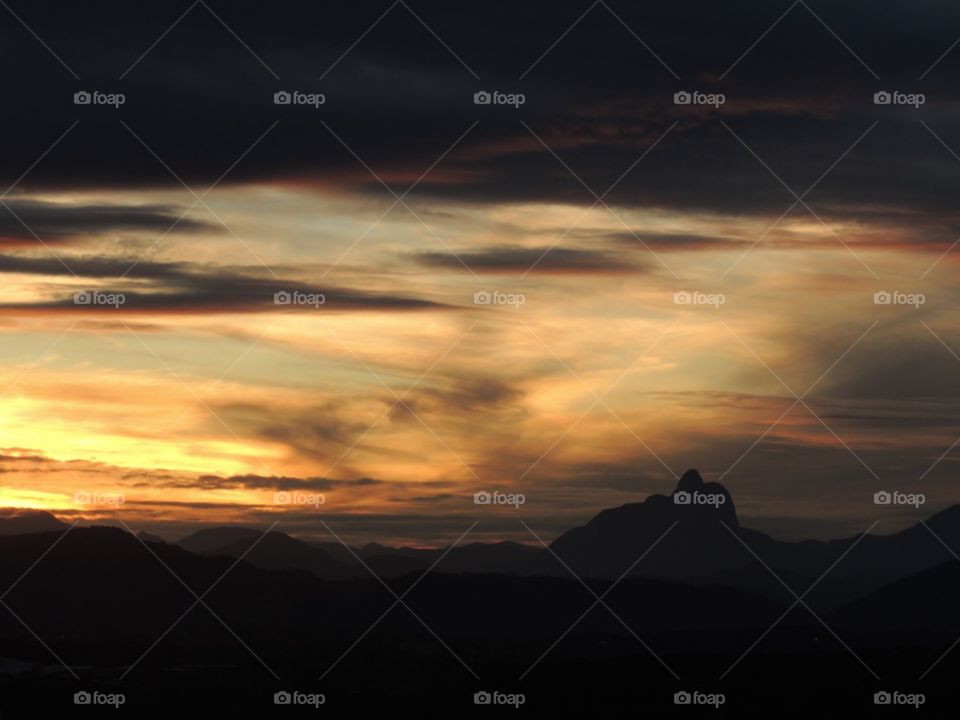 It’s look like a painting, but it’s the sunset of Macaé - Rio de Janeiro. The colors of the sky and the contours of the mountains always impress here. 