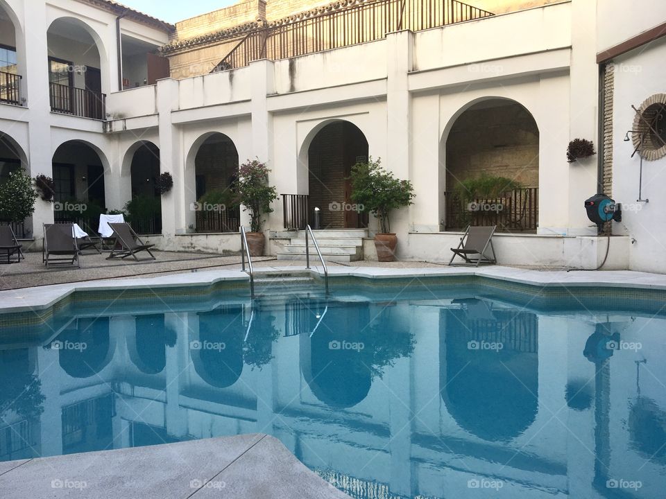 Patio with swimming pool by day