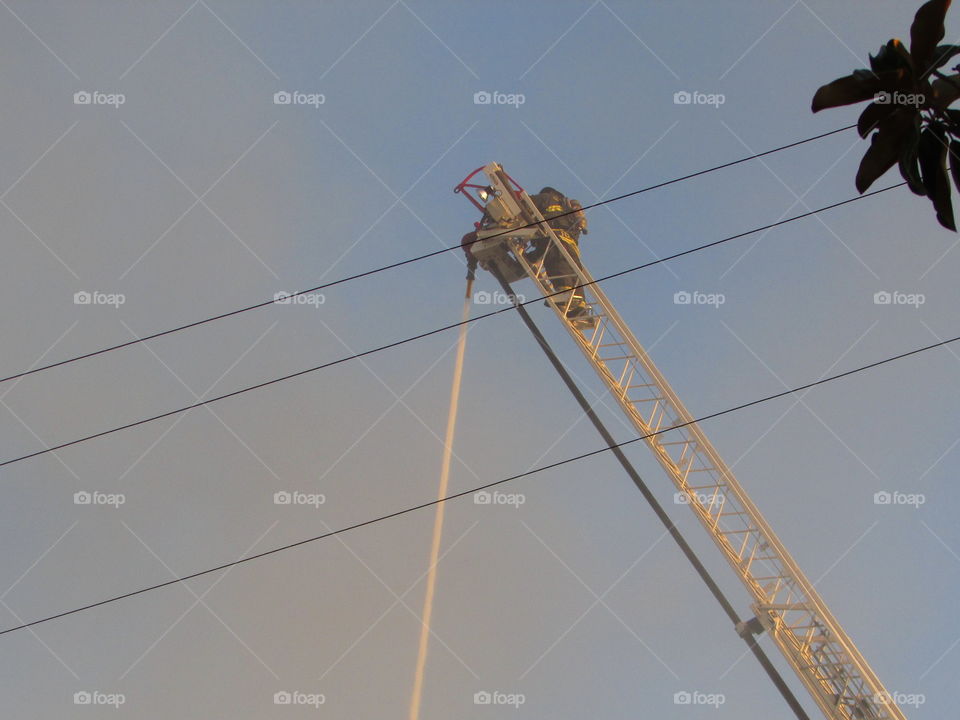 firefighter. fighting a building fire in downtown Sacramento