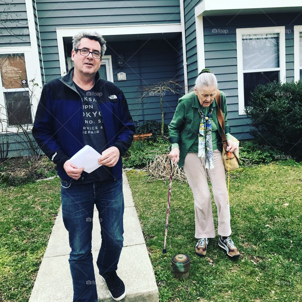 Adult Son Helping Elderly Mother 