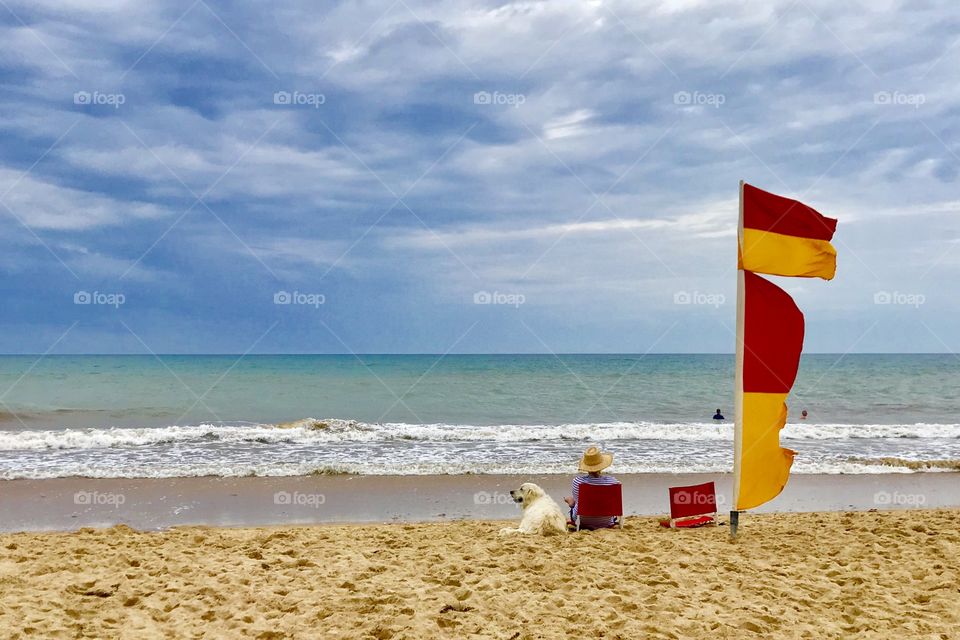 Relaxing with my dog on the beach