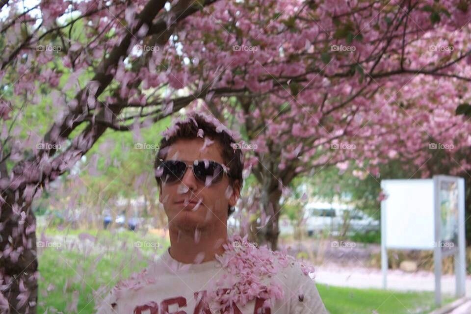 Flower raining on man