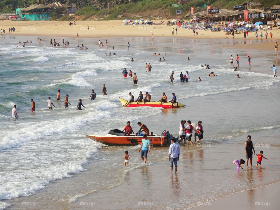 people having fun on the beach in summer