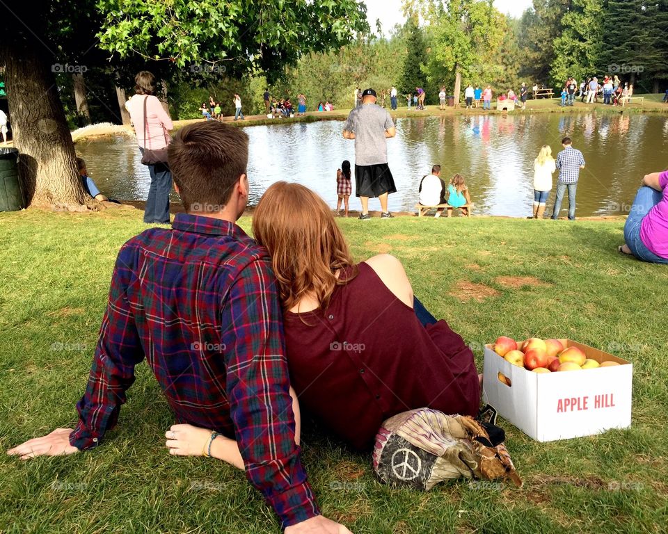 Apple hill. Cute couple enjoying the apples and fishing pond