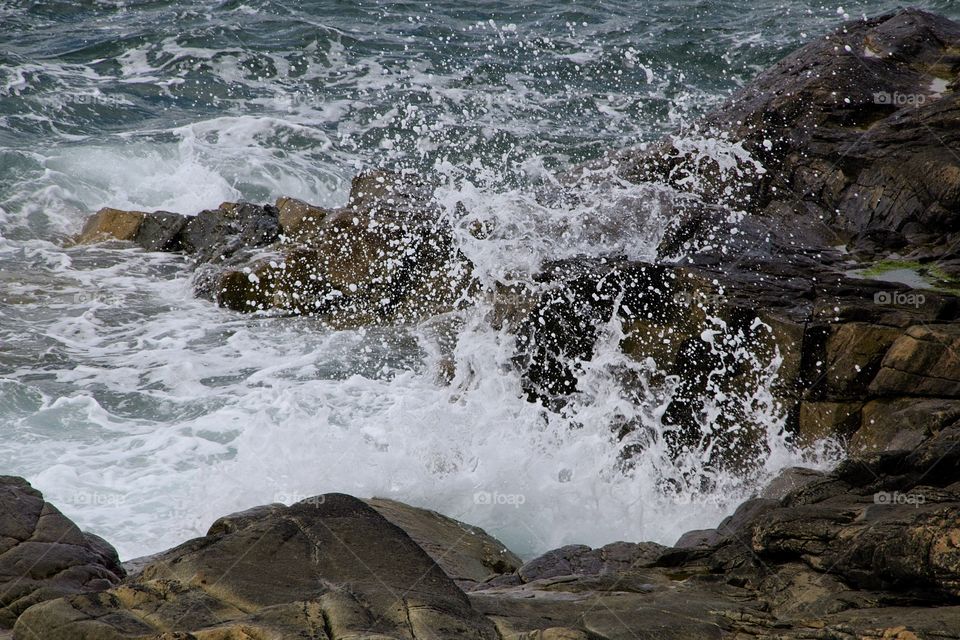 waves crashing on rocks
