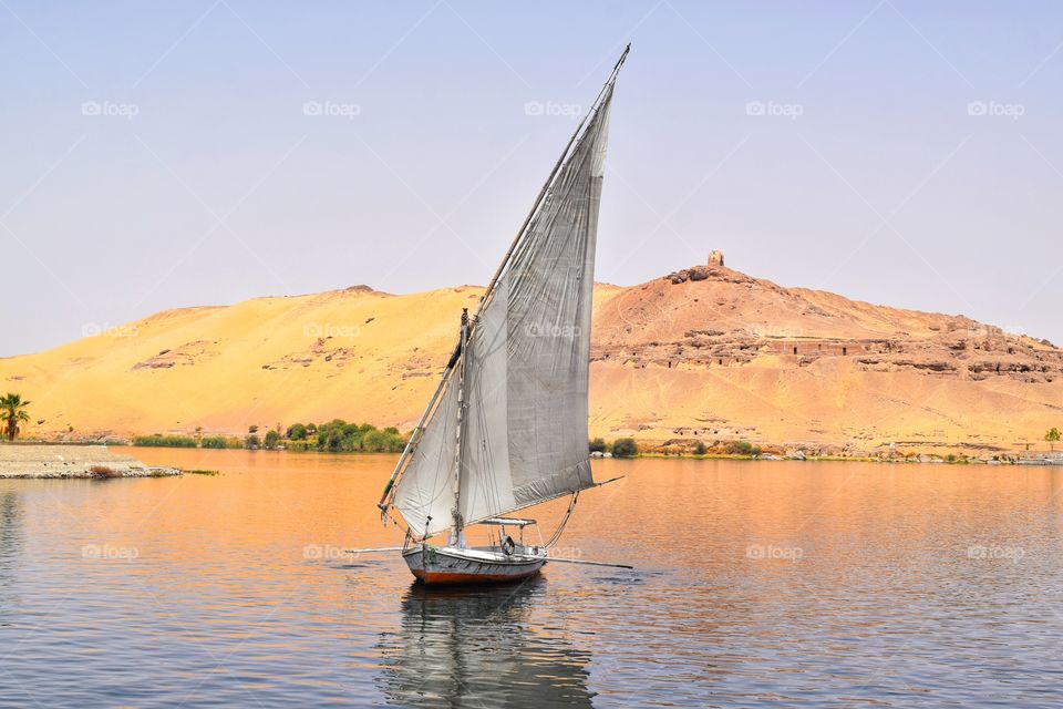 Boat in Egypt aswan on the river nile next to the nubian graves