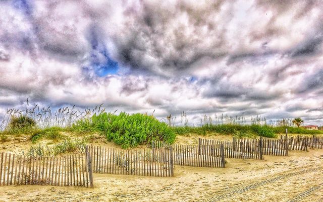 Cloudy skies over dunes
