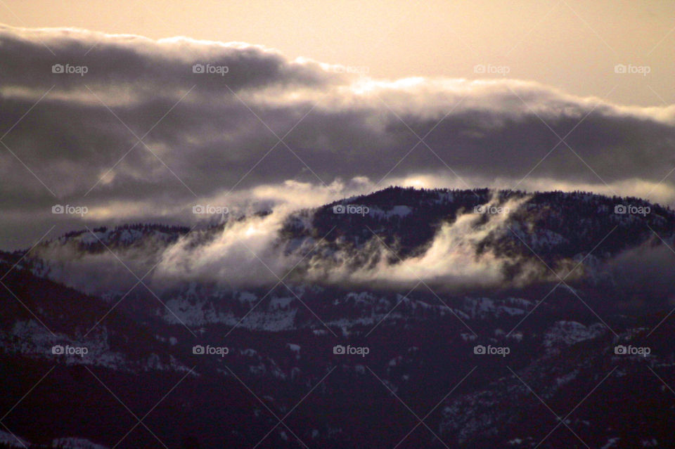 Everchanging West Coast sky! The clouds moved rapidly over the tops and through  the valley creating beautiful wisps of dancing clouds. 