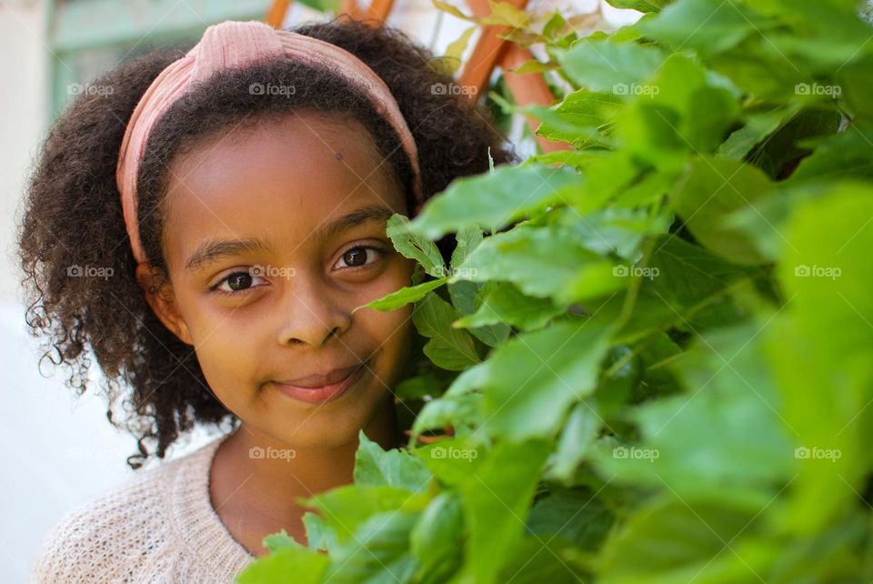 Little girl of mixed race with beautiful curly hair