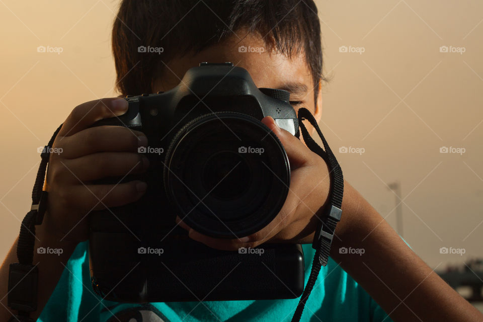 Little learner taking a photographs