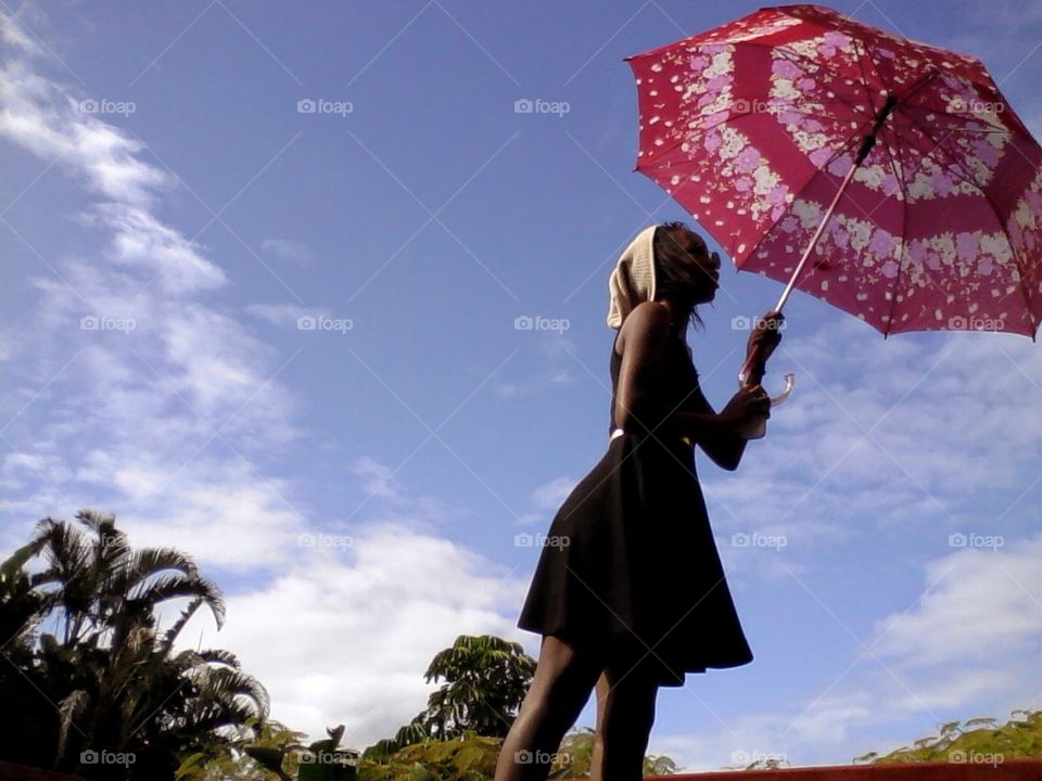 A young woman holding an umbrella
