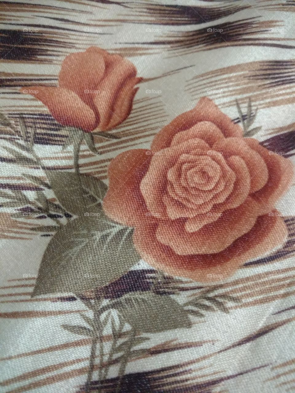 Rose print on the bedsheet.