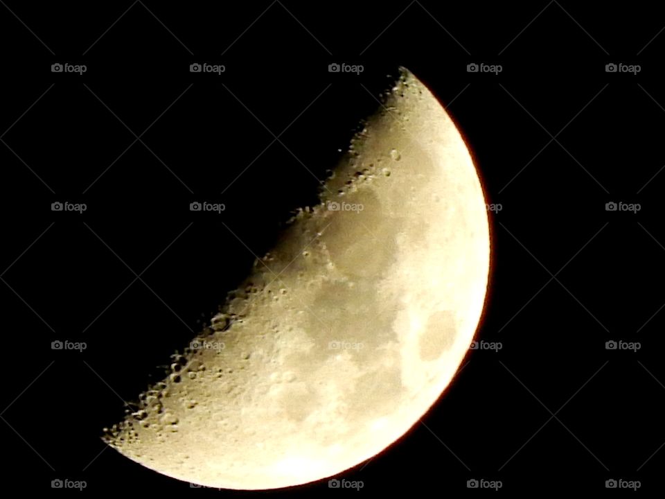 close up photo of the moon at half phase