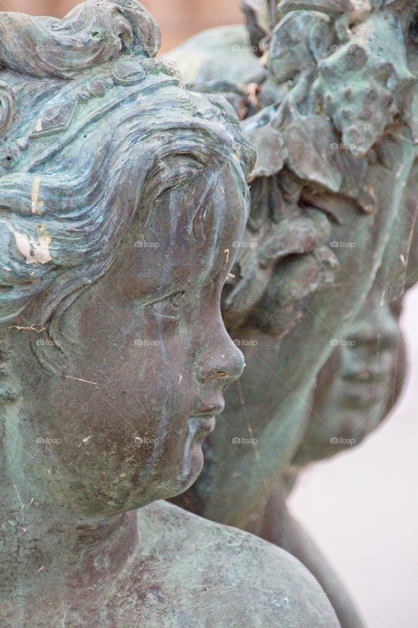 statue of a person in a garden