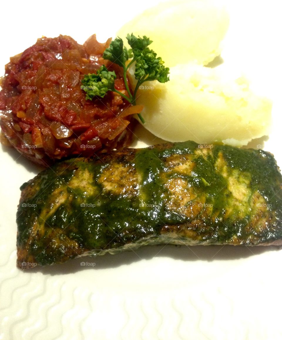 Salmon Pave. Oven roast fresh salmon with pesto crust, served with fresh herbs mashed potatoes and tomato compote