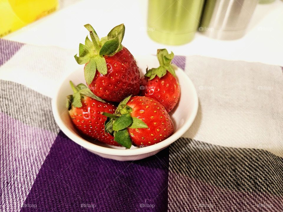 Strawberries and tablecloth