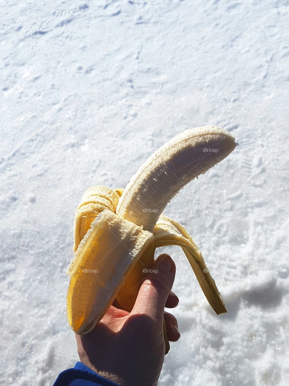 hand holding banana