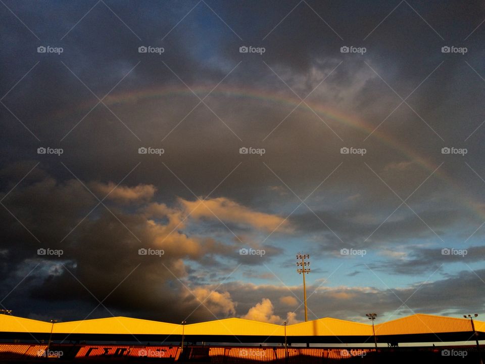 Rainbow over a football field
