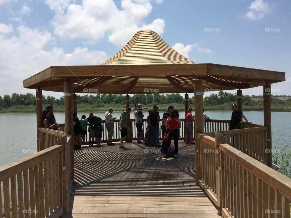 People watching a lake 