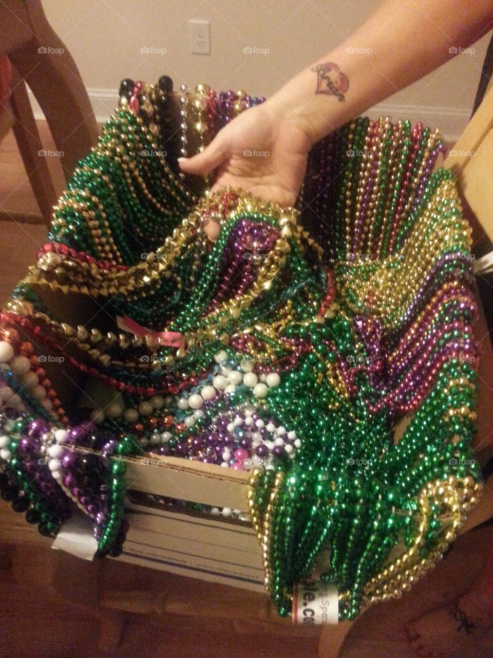Mardi Gras beads. big box full of Mardi Gras  beads