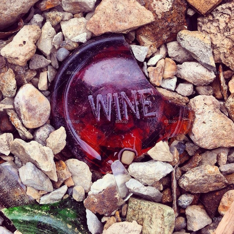 Broken wine bottle, river shoreline, michigan 