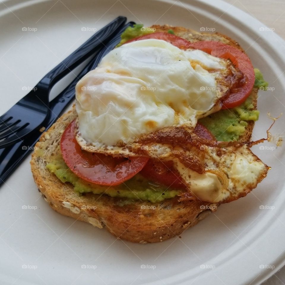 Avocado toast with tomato and egg