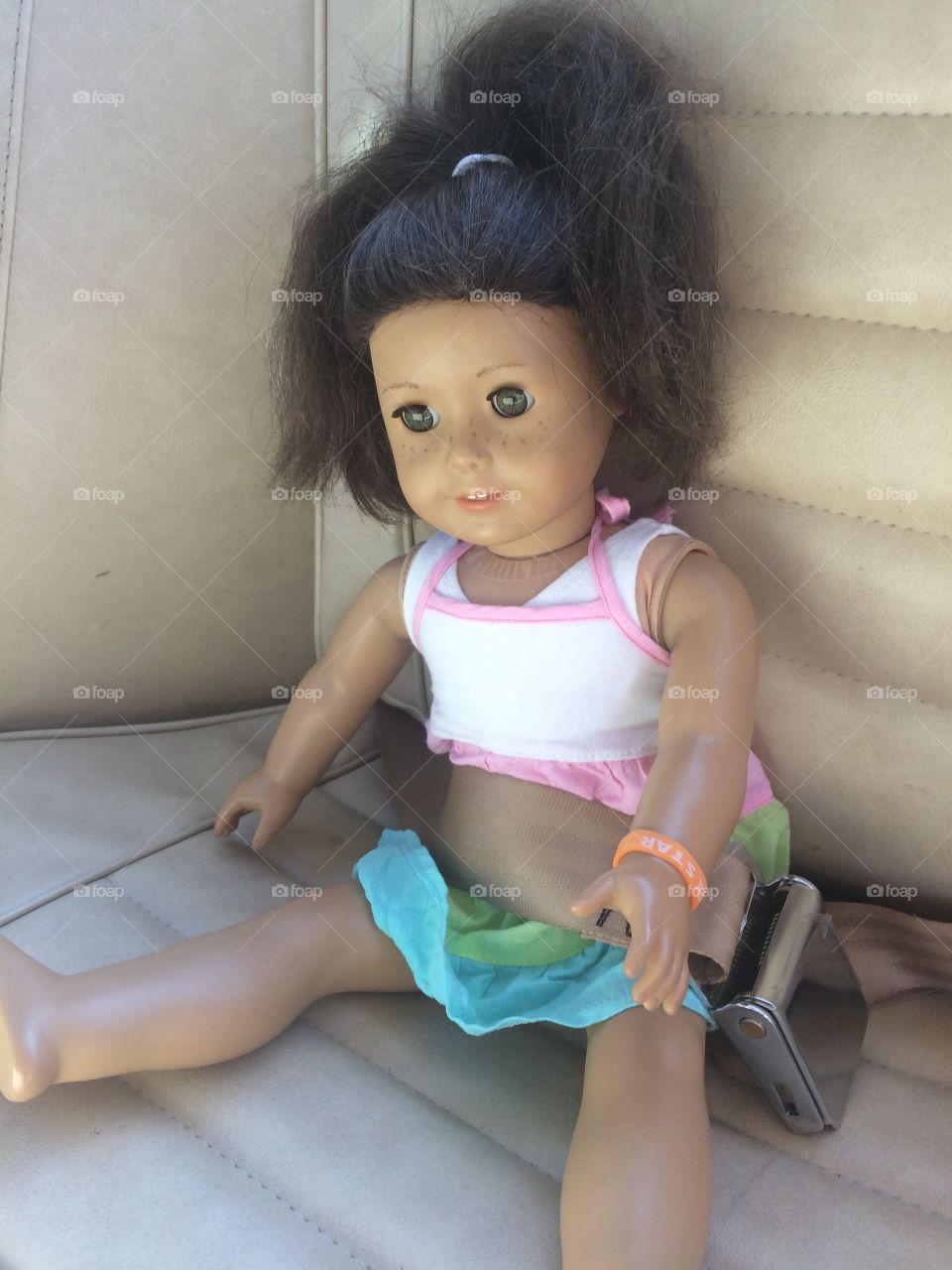 American Girl Doll. Buckle up!