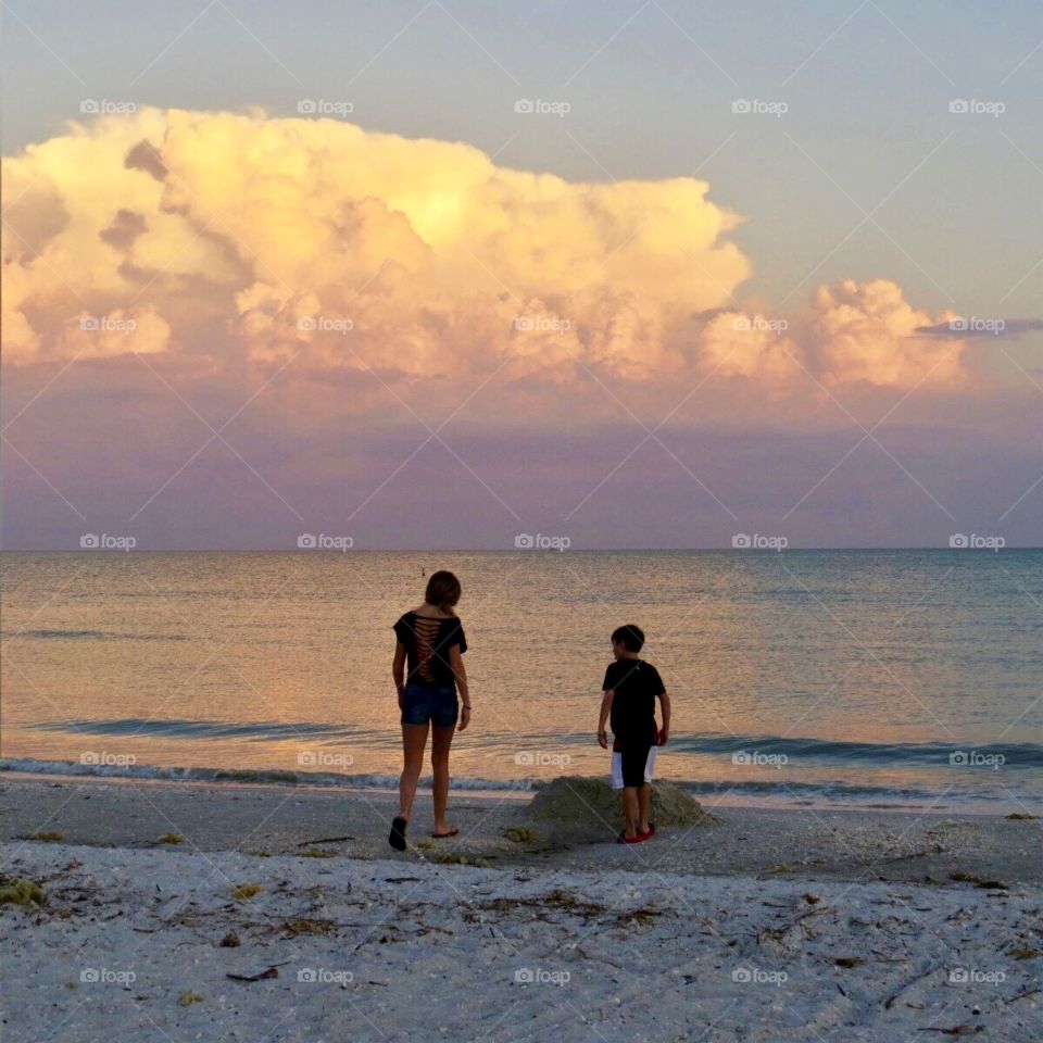 Children on beach in Sanibel Island Florida at sunset