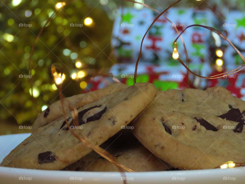 Santa’s cookies plated in front of Christmas decorations