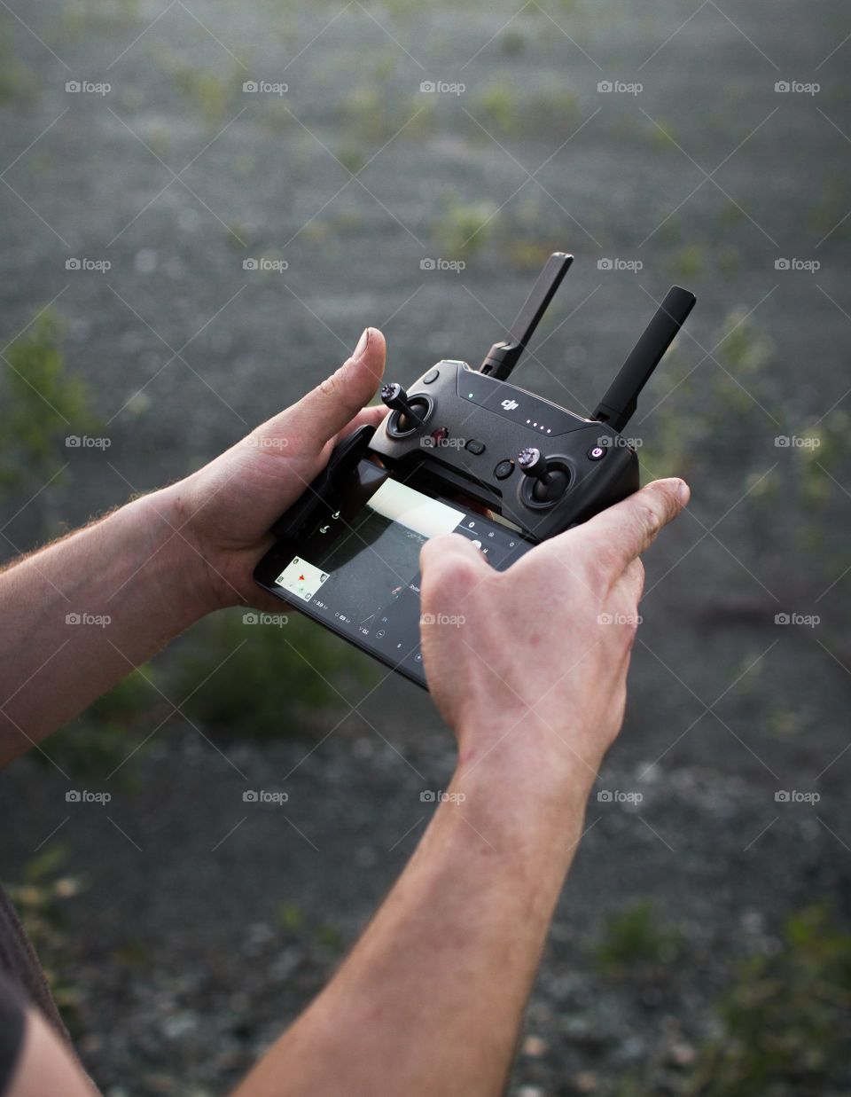 a person holding drone controller
