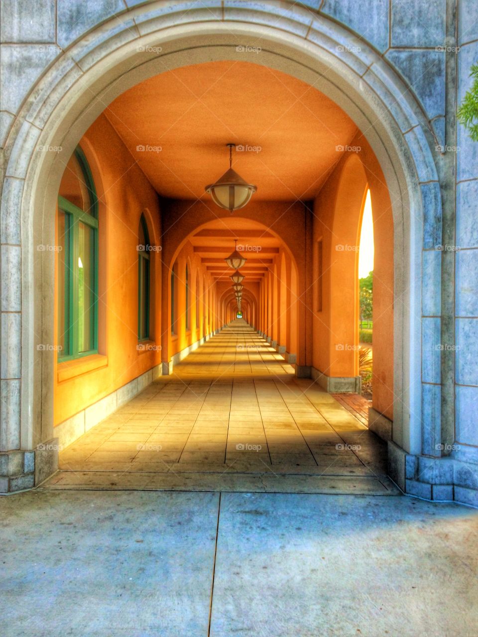 Sunlight shines down walkway . Golden hour at historic building