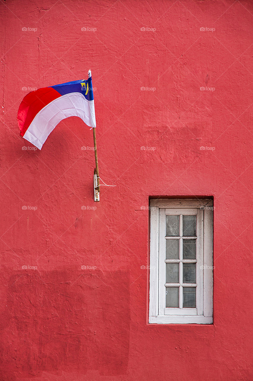 Flag on red wall