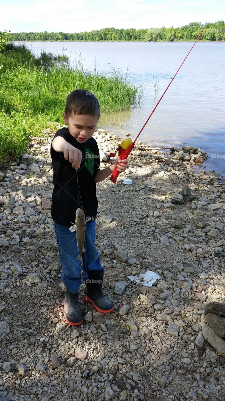child's  catch. excited to catch his little fish