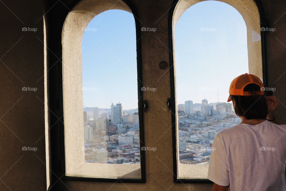 Visiting an old tower and enjoying the view of the city from above