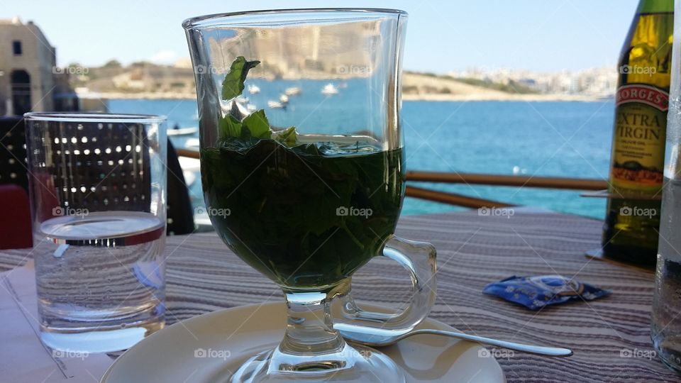 drinking mint tea by the sea side