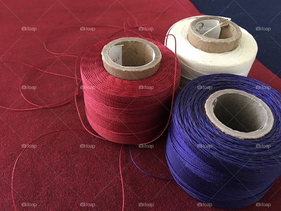 Three spools of upholstery thread