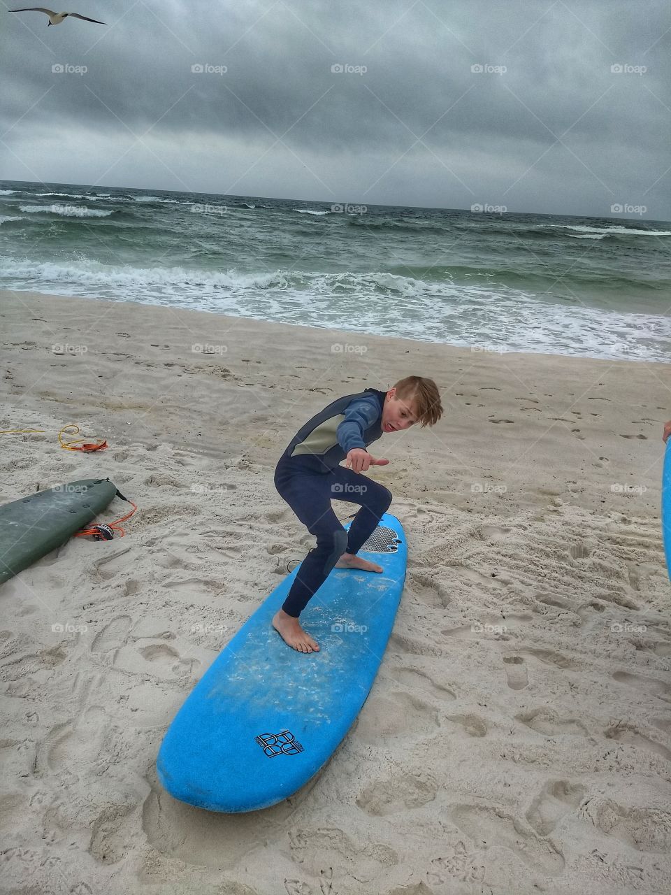 Boy practicing his surf moves