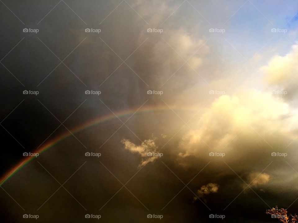 Dark clouds with rainbow 