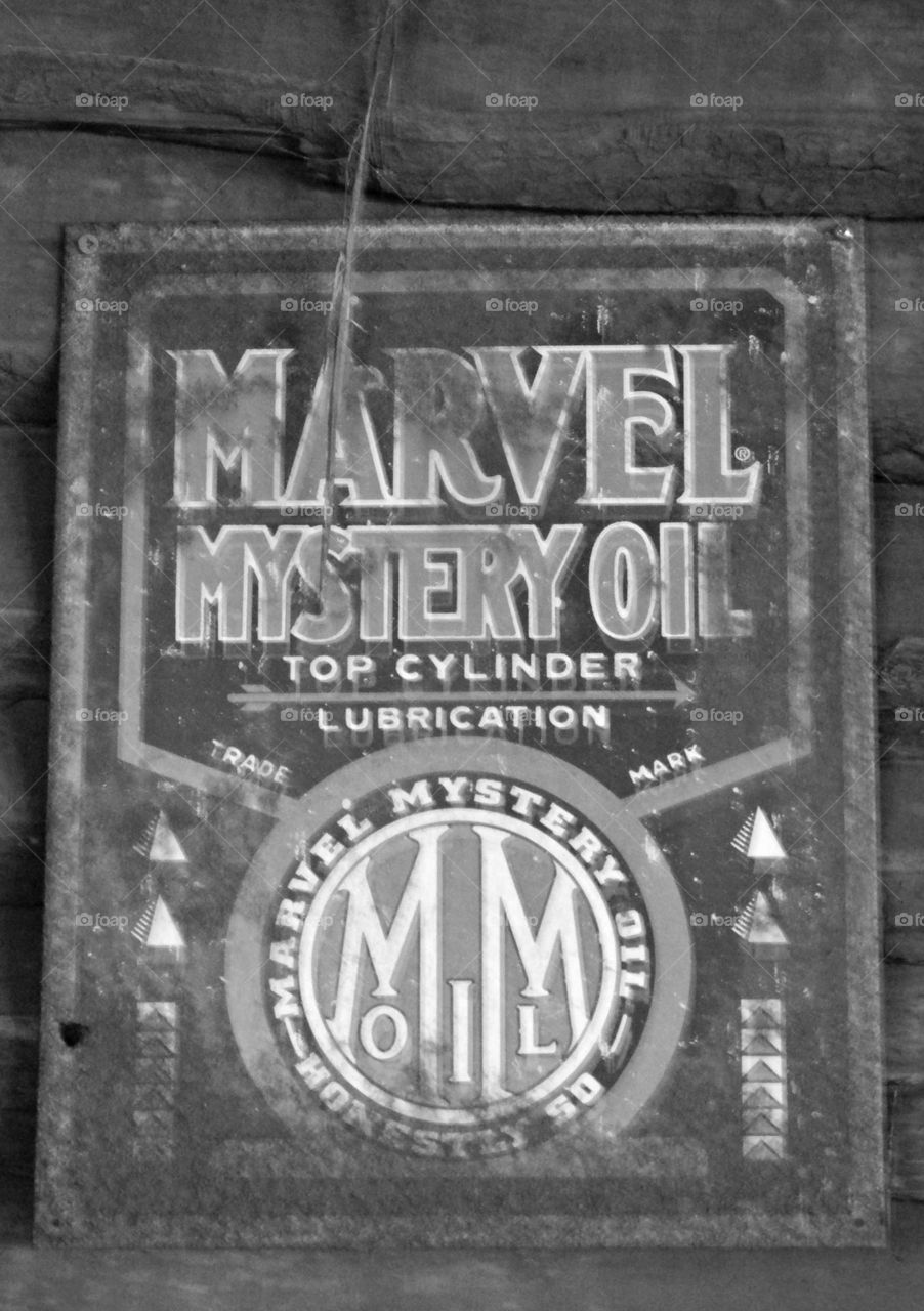 Vintage Vibes: Vintage metal sign hanging in a garage advertising MARVEL oil lubricant 