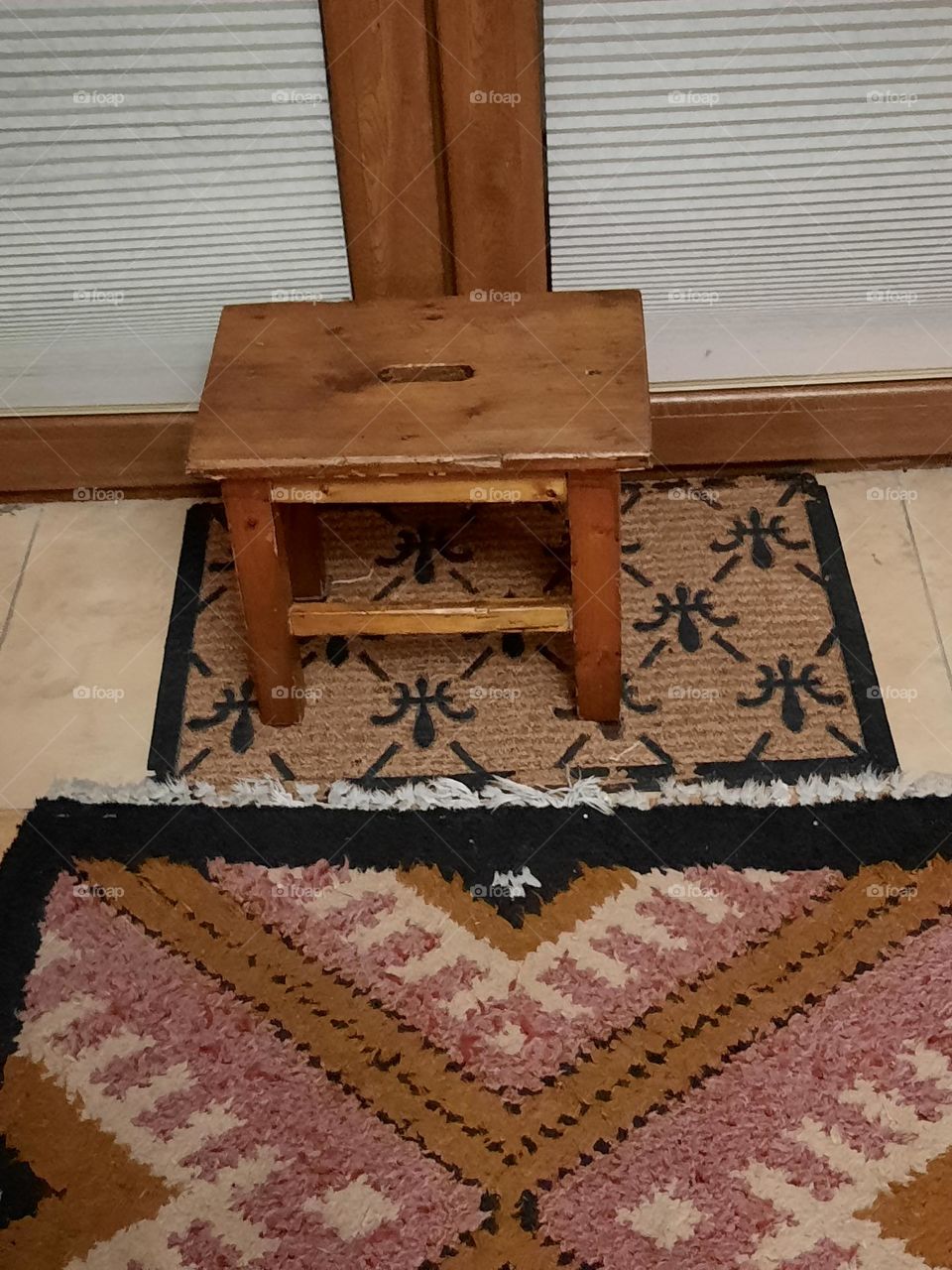 small stool on the background of the balcony door