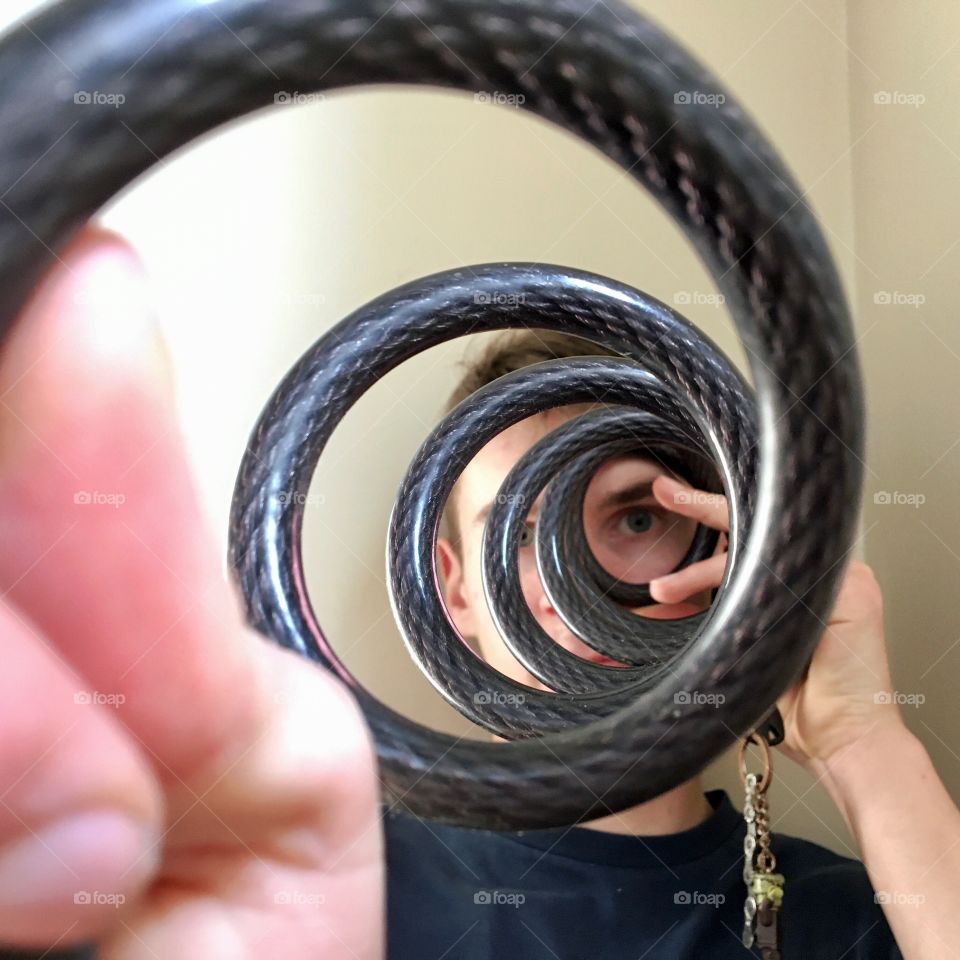 Bicycle lock stretched to create a coil 