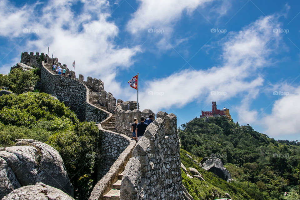 View of Palacio da Pena from the battlements at Castelo dos Mouros, Sintra, Portugal