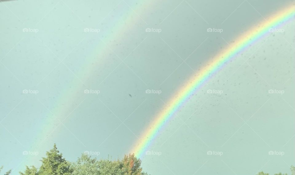 Driving North on rat. 95 I looked up to see this. It may not be advisable to pull out your camera at this particular time , but hey…double rainbow