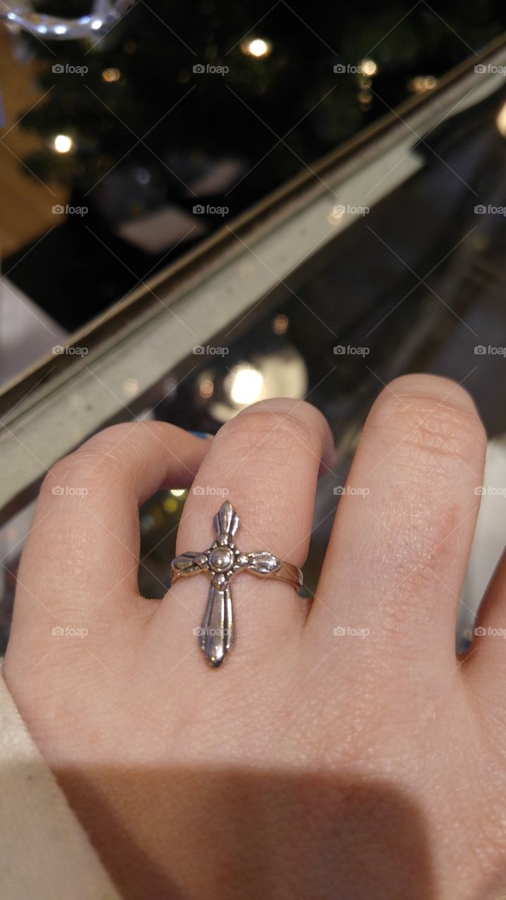 sterling silver cross ring in the jewelry section of a st