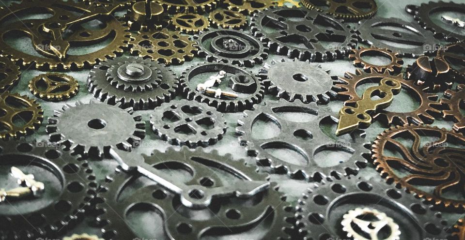 A collection of cogs in different metals