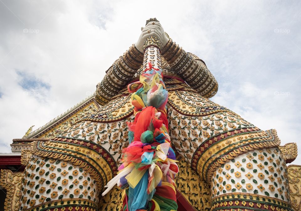 The famous Giant statue of Wat Chaeng (Wat Arun) in Bangkok Thailand is the favorite art for tourists    