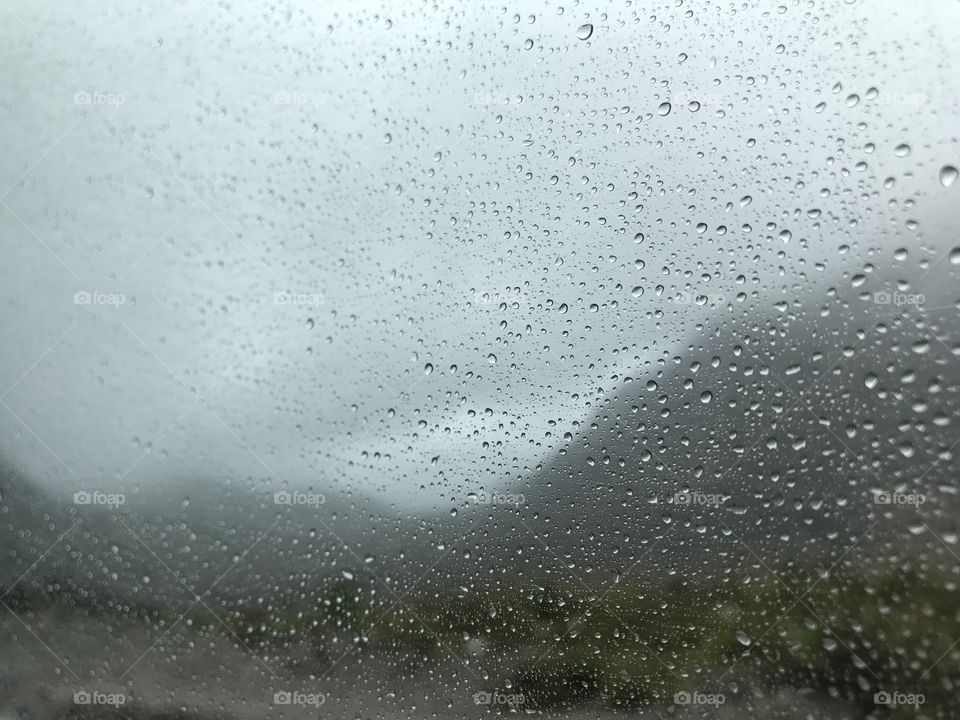 Raindrops on the van window overlooking Cajas National Park on our group’s travel van