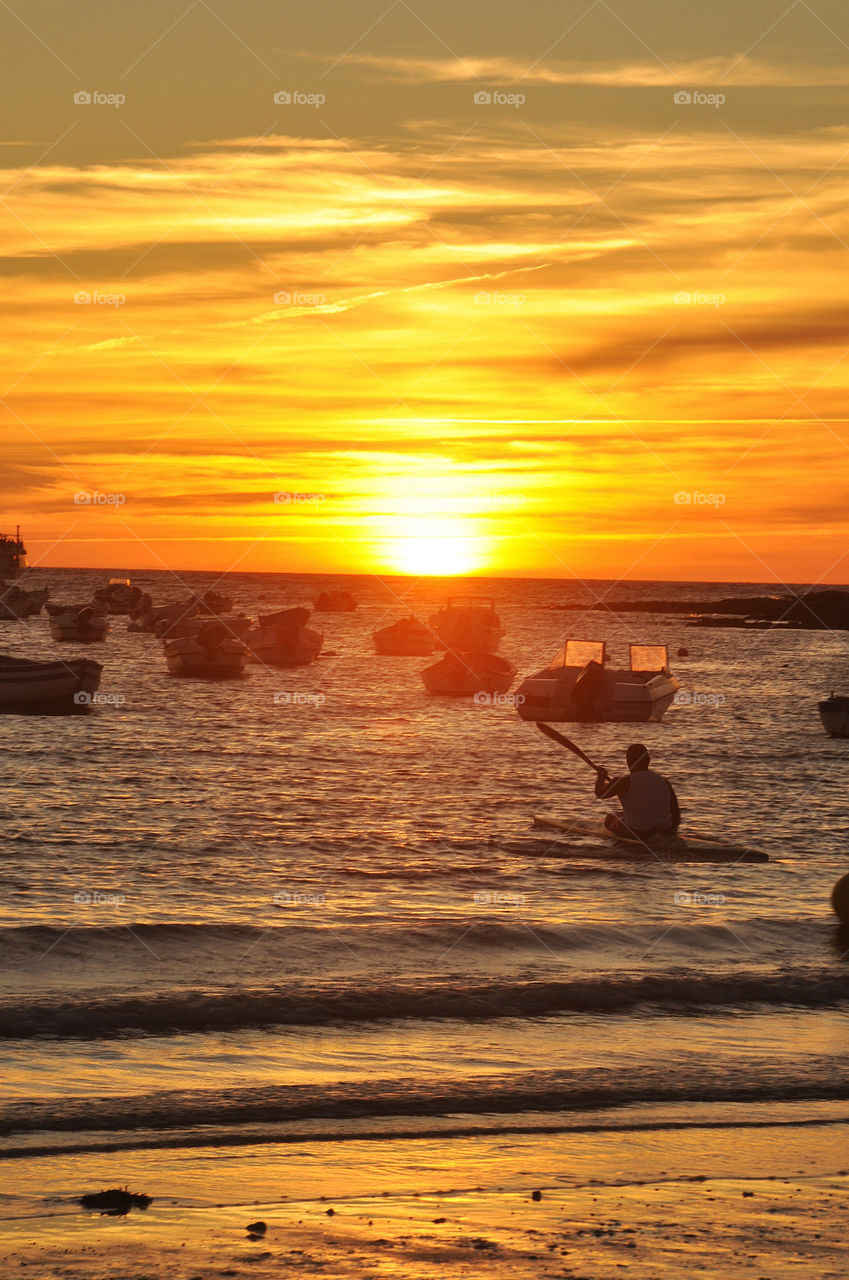 A boat on the sea in sunset