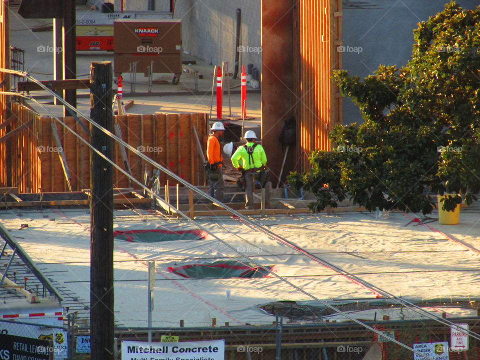 two guys talking about construction plans